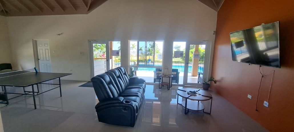 Clubhouse lounge with sofas and table tennis