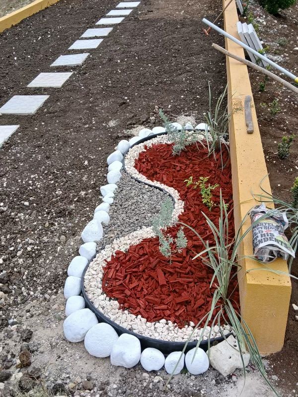 Decorative garden bed edged with white stones
