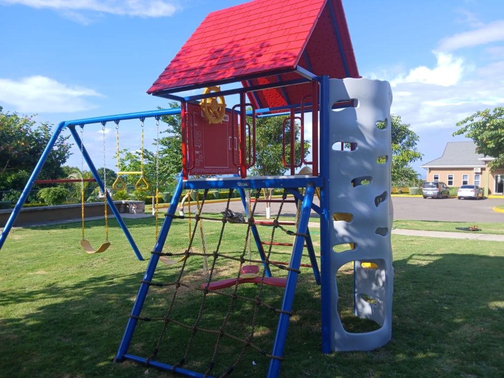 Children's playground with swings and climbing frame