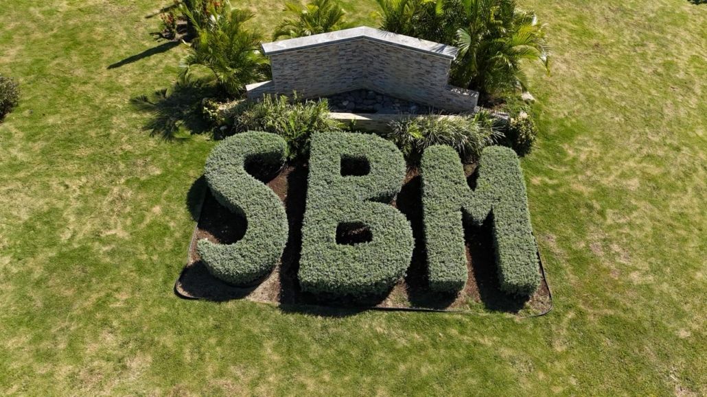 SBM letters shaped in hedge at the entrance